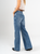 Ref: 065557 Jean Mom Flare, rígido, tiro alto, tono azul medio, detalle en pretina