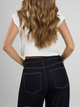 Ref: 0610402 Crop top tejido acanalado, cuello alto, tono crudo.