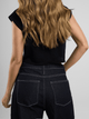 Ref: 0610403 Crop top tejido acanalado, cuello alto, tono negro.