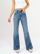 Ref: 065574 Jean semi flare, stretch, tiro alto, con abertura en ruedo, azul medio