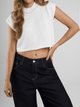 Ref: 0610402 Crop top tejido acanalado, cuello alto, tono crudo.