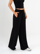Ref: 069623 Pantalón mom flare, sin prense, corte delantero, pretina con resorte, tono negro