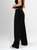 Ref: 069623 Pantalón mom flare, sin prense, corte delantero, pretina con resorte, tono negro