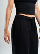 Ref: 069623 Pantalón mom flare, sin prense, corte delantero, pretina con resorte, tono negro