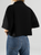 Ref: 0610094 Camisa tejido plano liviano, tono negro, manga corta, solapa, con bolsillo cargo